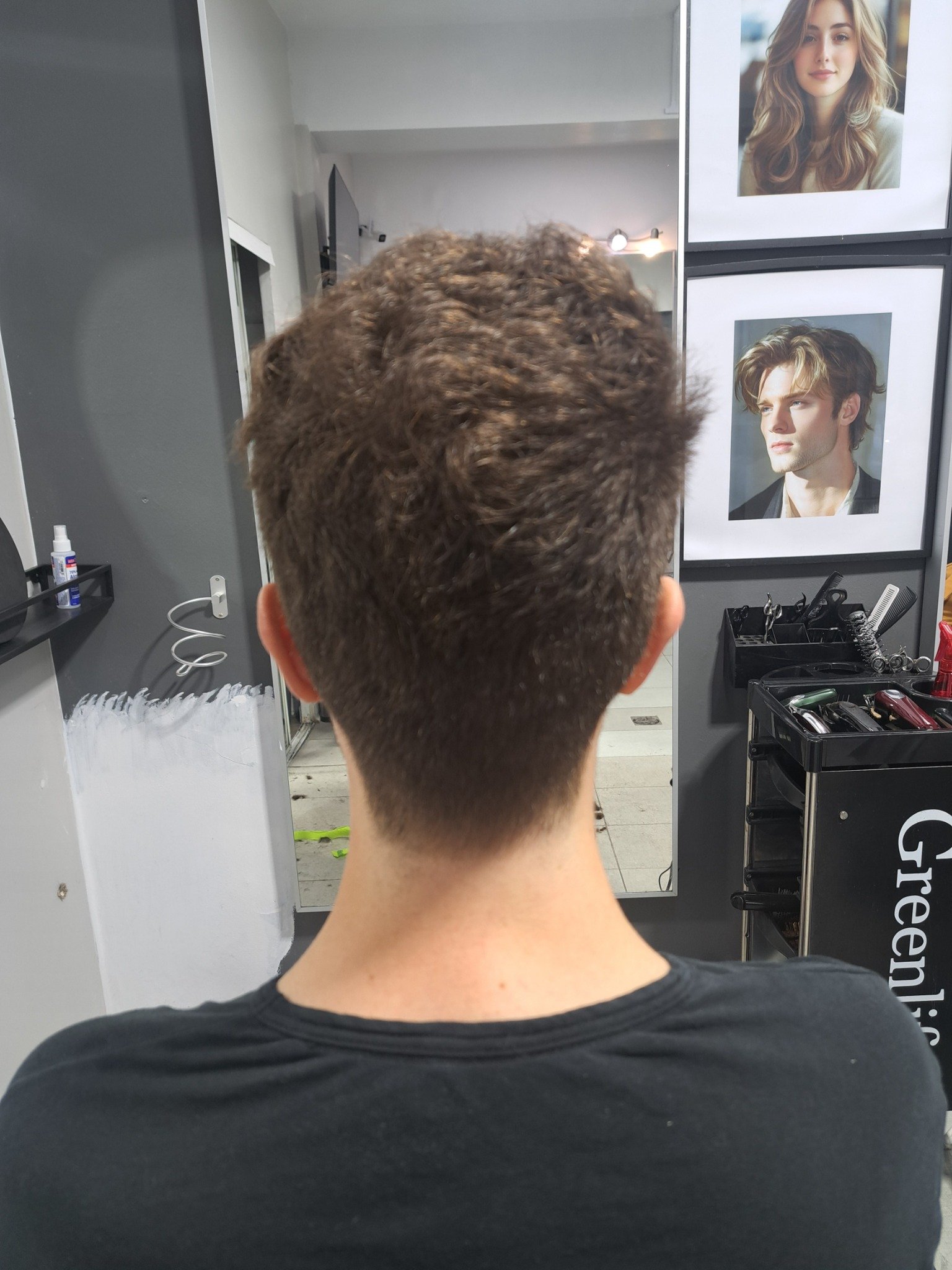 Textured men's haircut with a clean tapered neckline by Konstantin Stylist