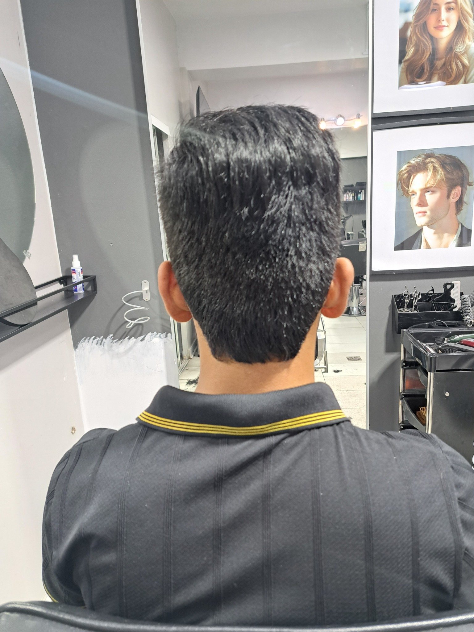 Classic men's haircut with a neat tapered finish by Konstantin Stylist