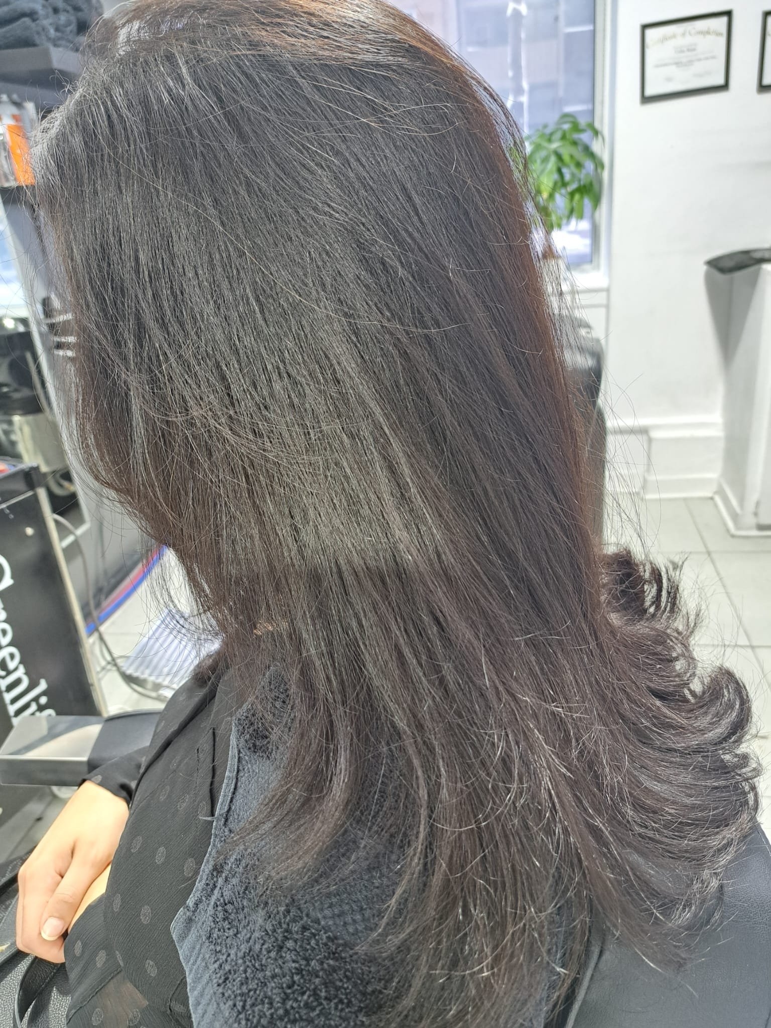 Smooth dark brunette hair with layered curled ends by Konstantin Stylist