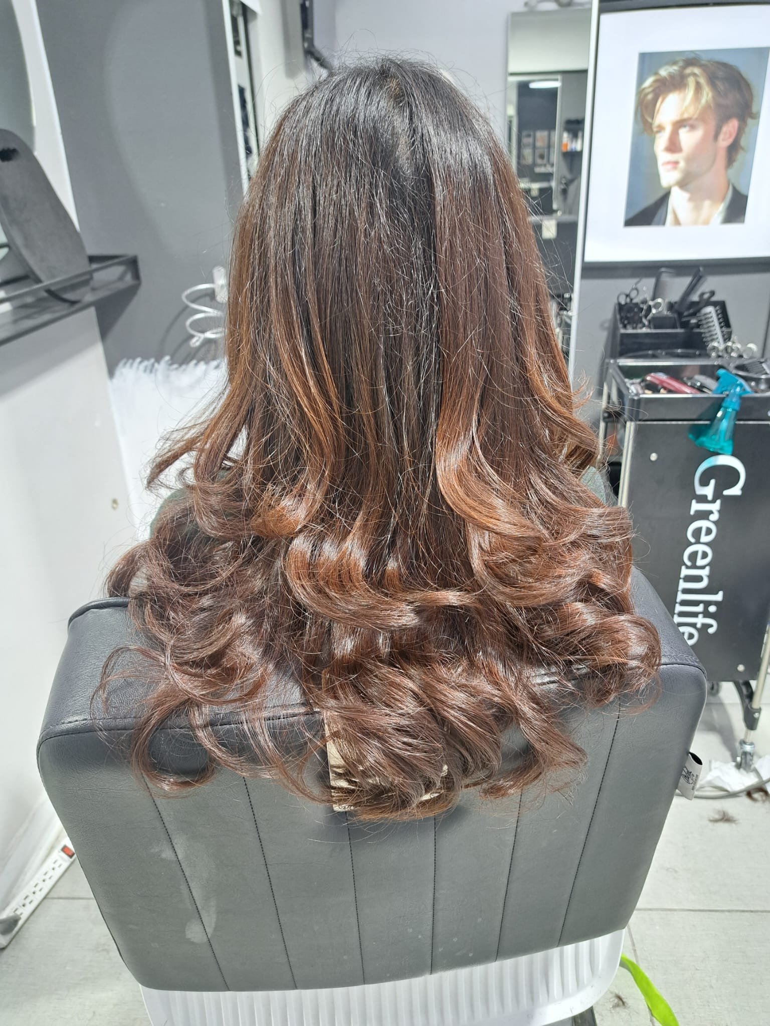 Long brunette layered haircut with voluminous curls by Konstantin Stylist